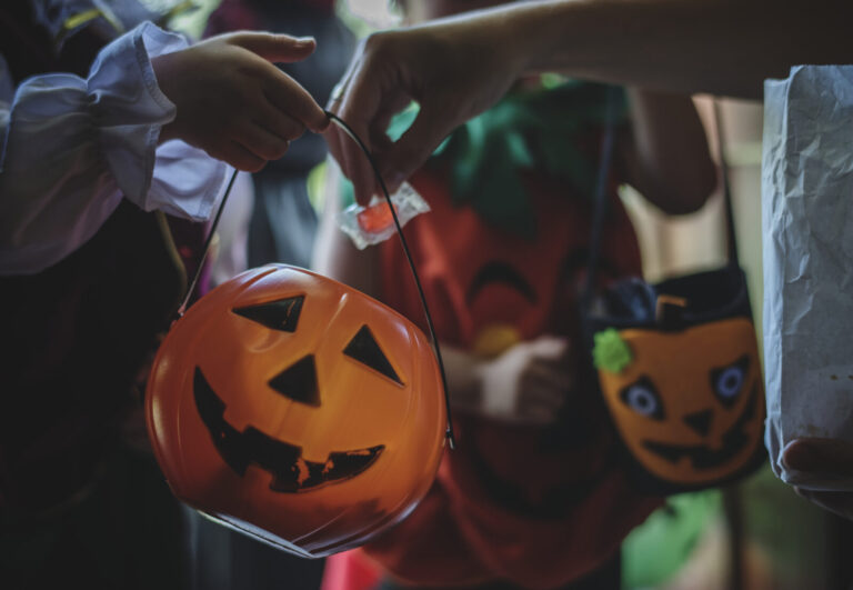 Little children trick or treating on Halloween